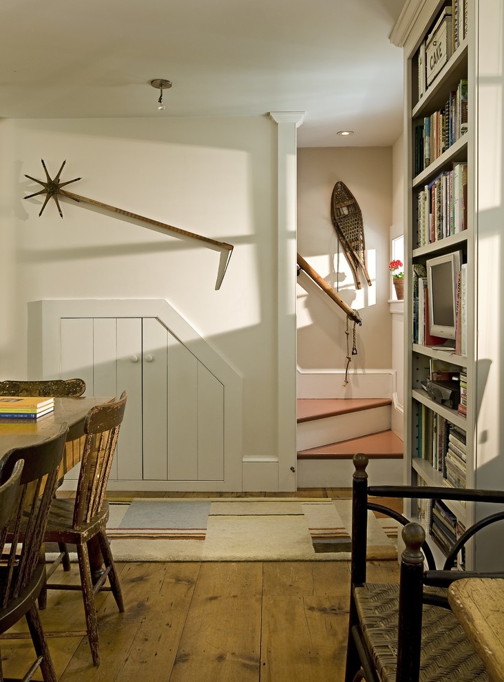 Inspiration for a timeless dining room remodel in Burlington with white walls