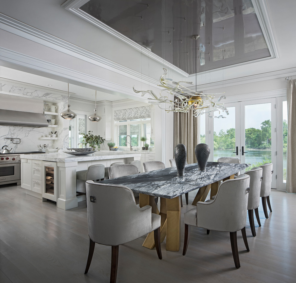 Example of a transitional gray floor dining room design in Detroit with gray walls