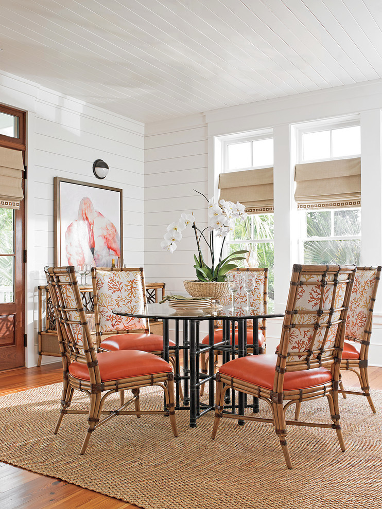 Example of a mid-sized beach style medium tone wood floor kitchen/dining room combo design in Orange County with white walls