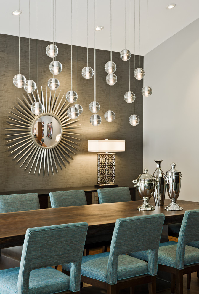 Example of a mid-century modern dining room design in Minneapolis with gray walls