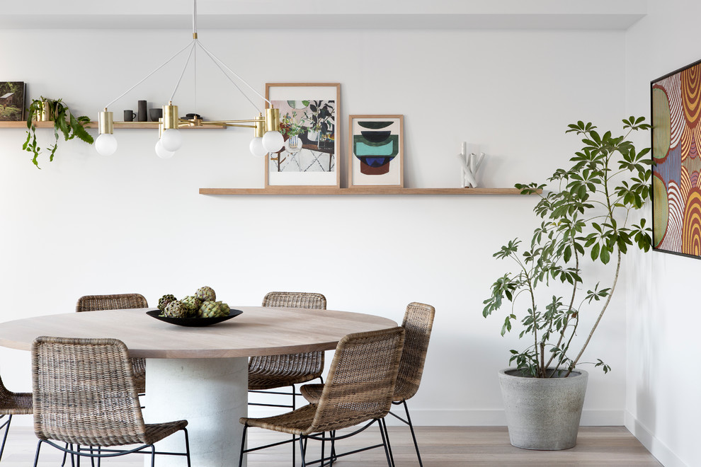Inspiration for a modern light wood floor dining room remodel in Melbourne with white walls