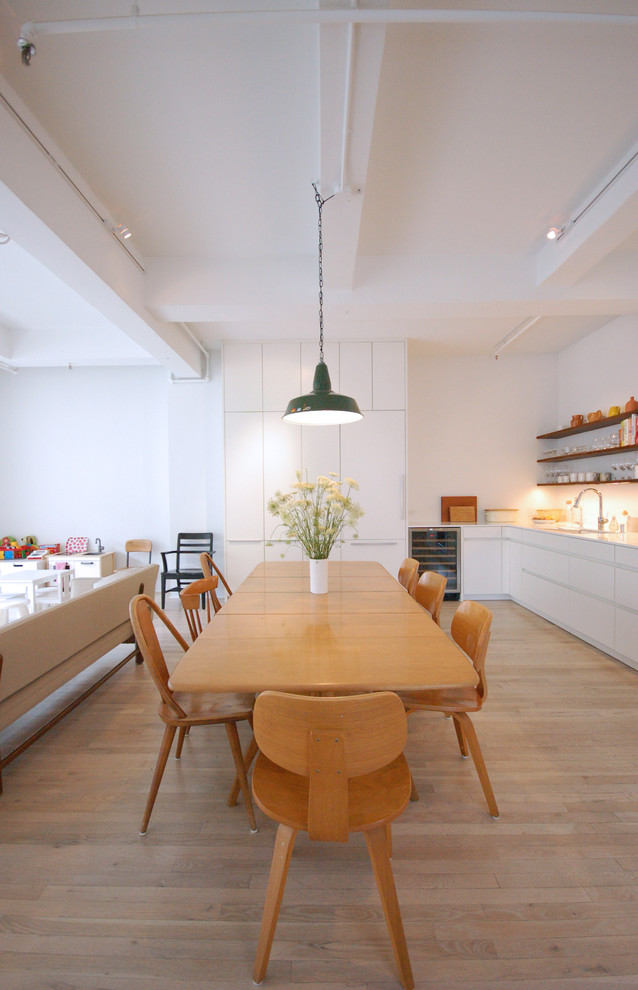 Inspiration for a scandinavian kitchen/dining room in New York with white walls.
