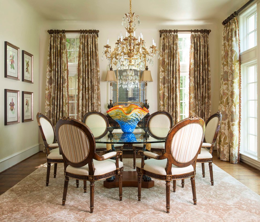 Example of a mid-sized classic dark wood floor enclosed dining room design in Other with beige walls