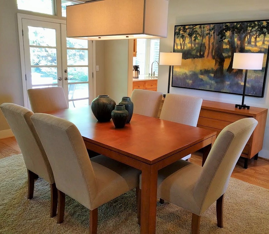 Photo of a medium sized contemporary enclosed dining room in San Francisco with light hardwood flooring and brown floors.