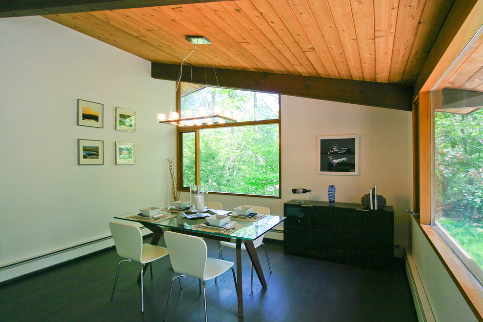 Photo of a medium sized contemporary open plan dining room in Boston with white walls and dark hardwood flooring.