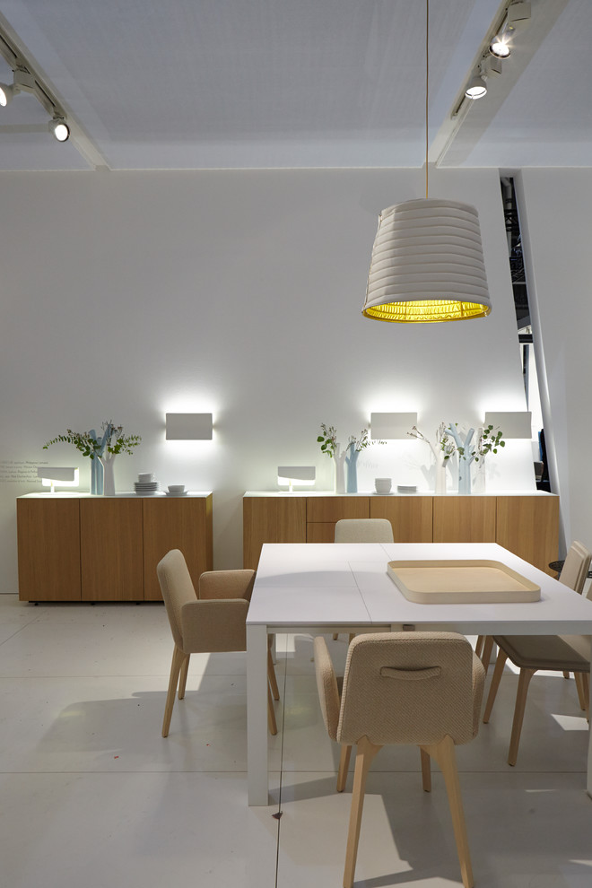 Example of a trendy dining room design in Chicago with white walls