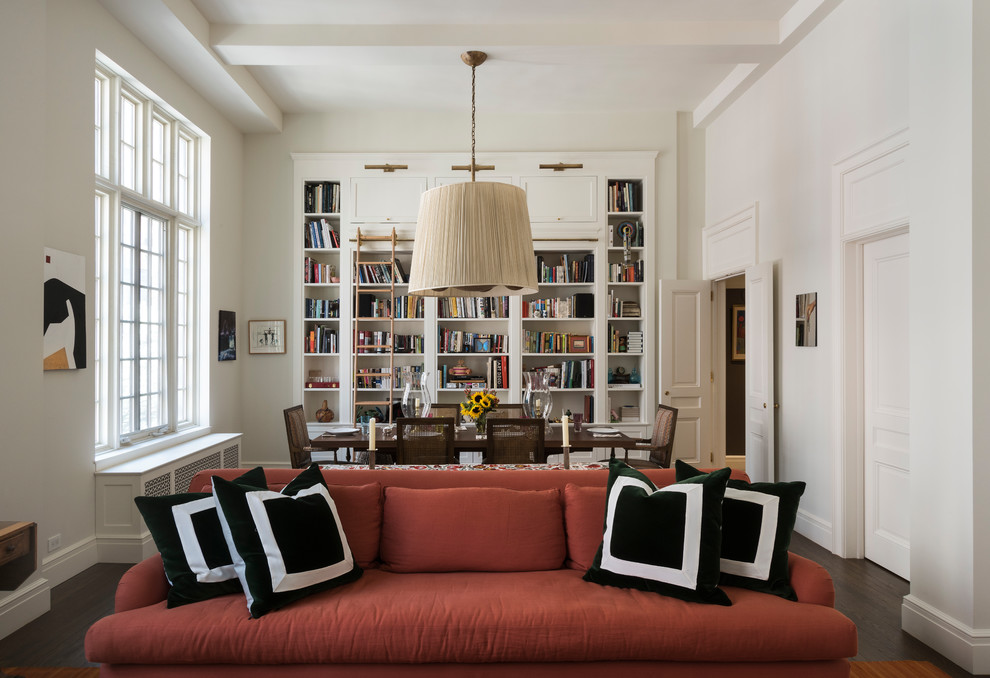 Inspiration for a mid-sized timeless dark wood floor and brown floor great room remodel in New York with white walls, a standard fireplace and a wood fireplace surround