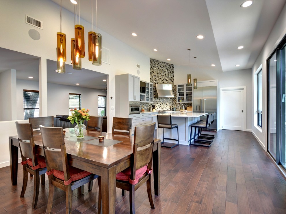Inspiration for a large contemporary kitchen/dining room in Austin with dark hardwood flooring, grey walls and no fireplace.