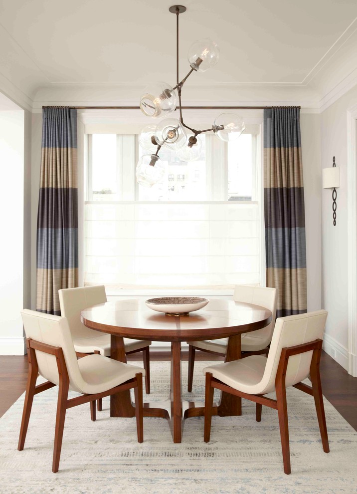 Dining room - large transitional dark wood floor dining room idea in New York with gray walls