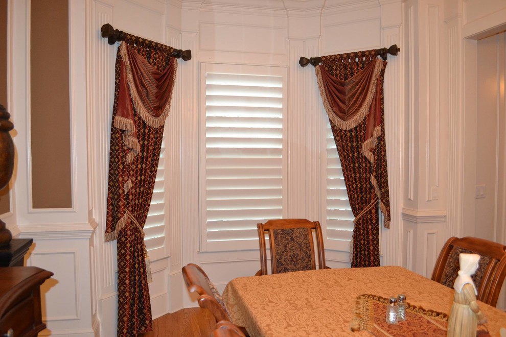 Medium sized classic enclosed dining room in Atlanta with white walls, medium hardwood flooring and no fireplace.