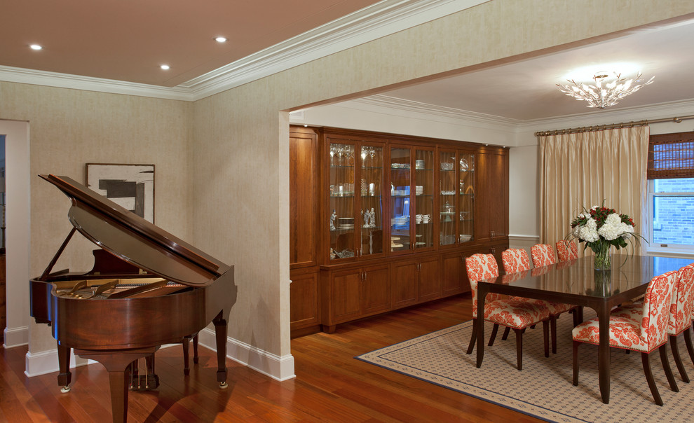 Design ideas for a traditional dining room in DC Metro with beige walls, dark hardwood flooring and feature lighting.