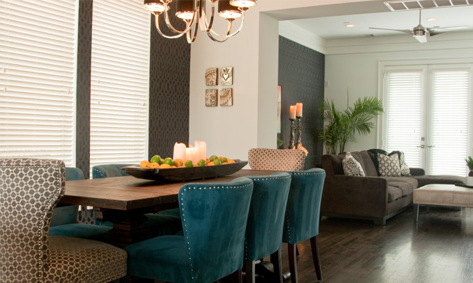 Inspiration for a contemporary dining room in Houston with white walls and dark hardwood flooring.