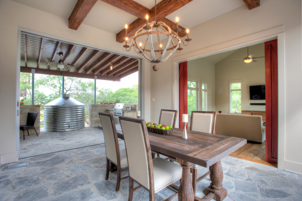 Photo of a rural dining room in Austin with white walls.