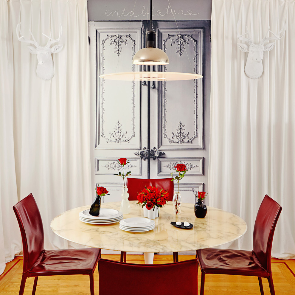 Design ideas for a bohemian dining room in San Francisco with medium hardwood flooring.