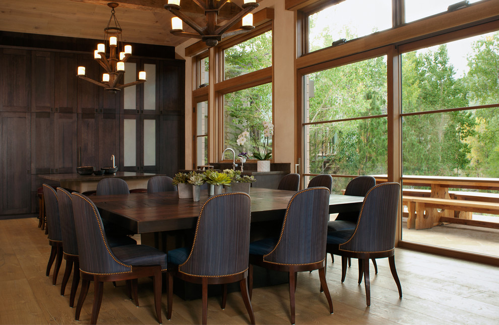 Kitchen/dining room combo - large contemporary medium tone wood floor kitchen/dining room combo idea in Denver with beige walls and no fireplace