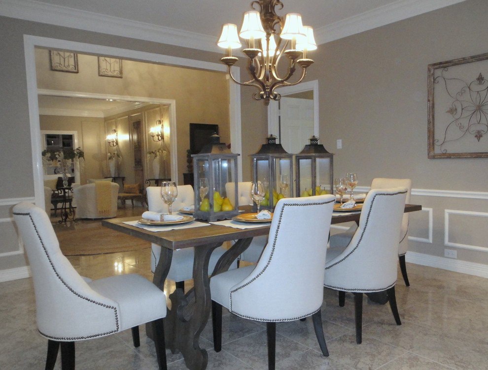 Example of a large classic porcelain tile kitchen/dining room combo design in Houston with beige walls and no fireplace