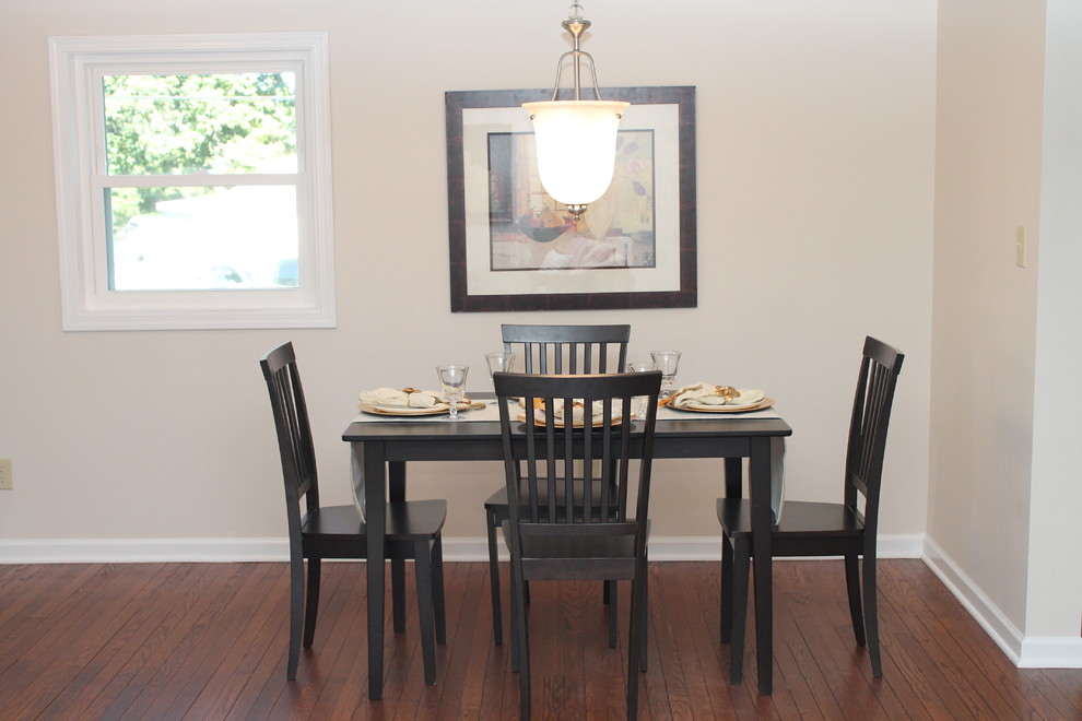 Photo of a small bohemian open plan dining room in New York with beige walls and dark hardwood flooring.