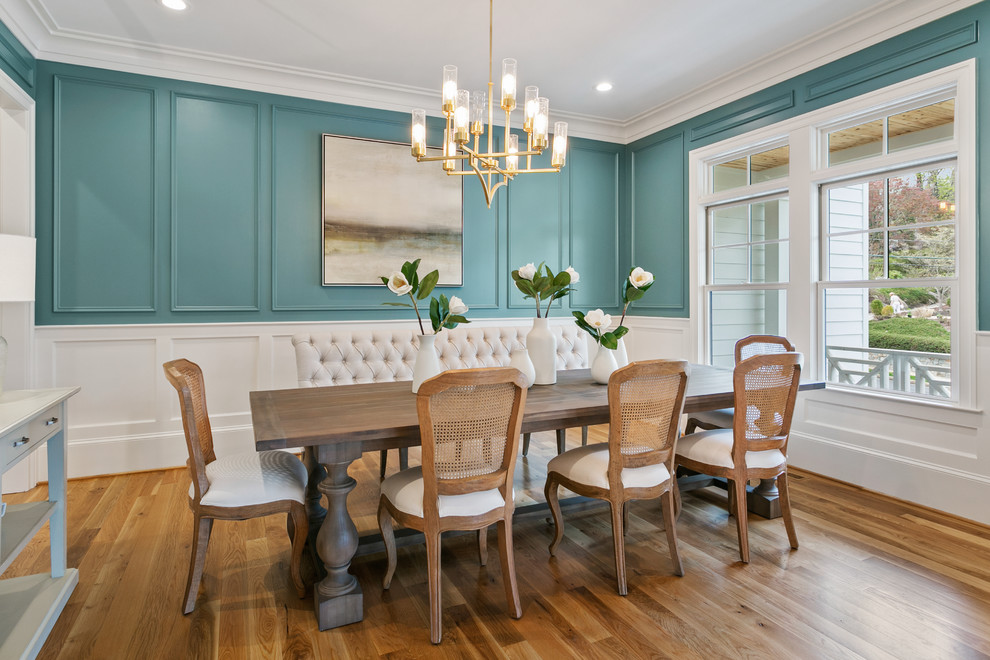 Inspiration for a medium sized classic enclosed dining room in Other with blue walls, medium hardwood flooring and brown floors.