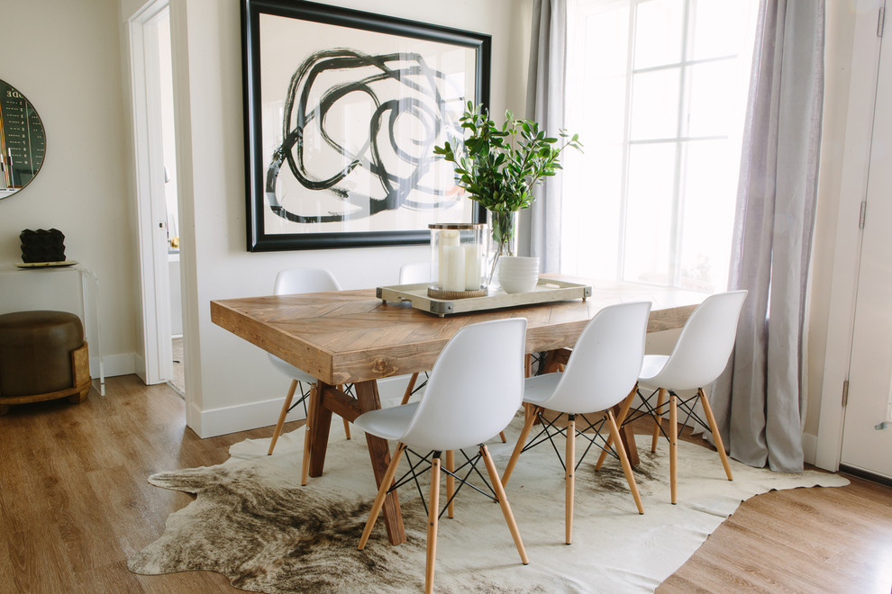 Photo of a small scandi dining room in Salt Lake City with light hardwood flooring and no fireplace.