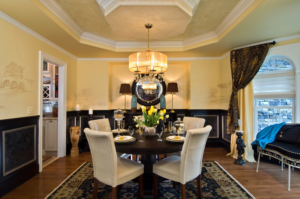 Elegant dining room photo with yellow walls