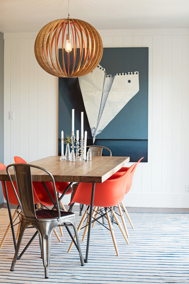This is an example of a contemporary dining room in San Francisco with white walls.