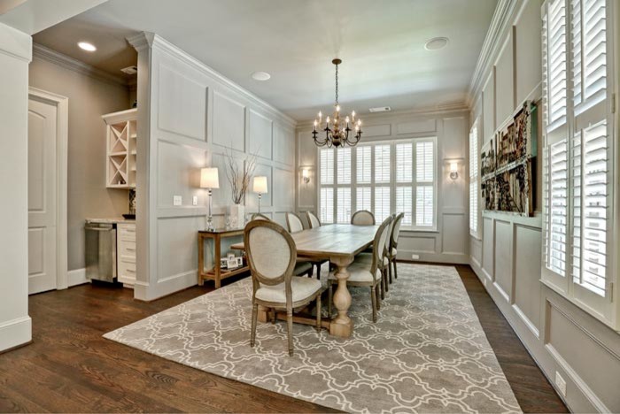This is an example of a large coastal dining room in Atlanta with grey walls, dark hardwood flooring and brown floors.