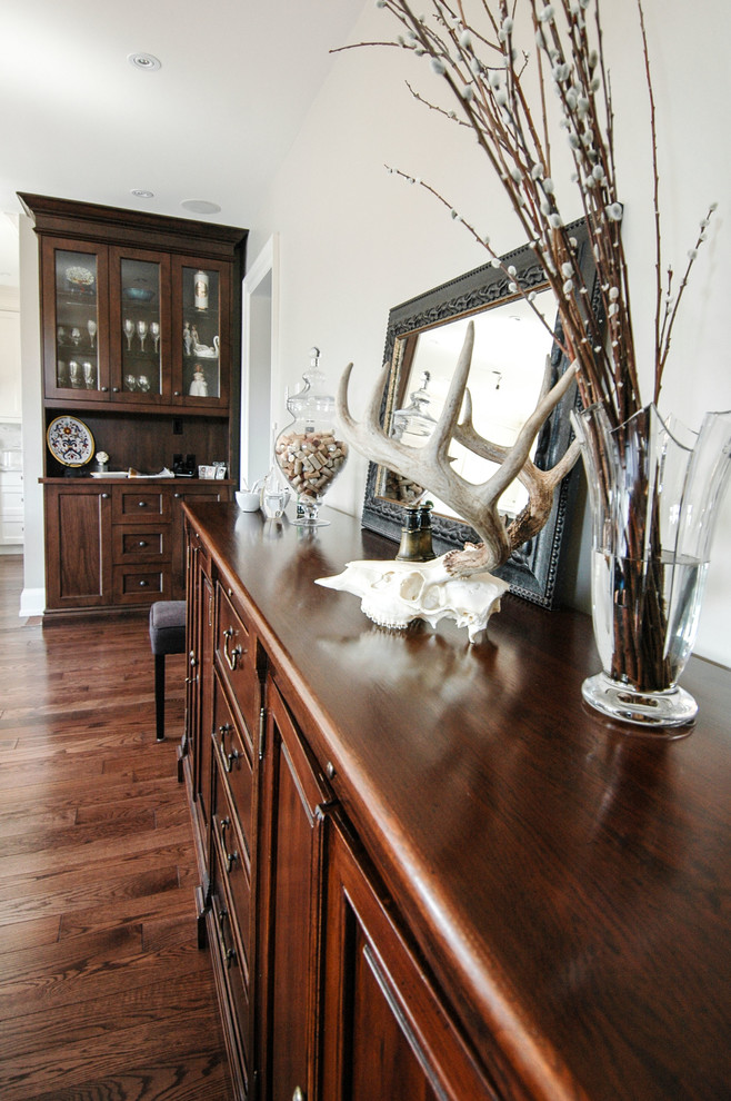 Mid-sized elegant dark wood floor great room photo in Toronto with white walls and a standard fireplace