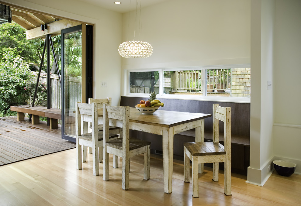 Contemporary dining room in Seattle with white walls.
