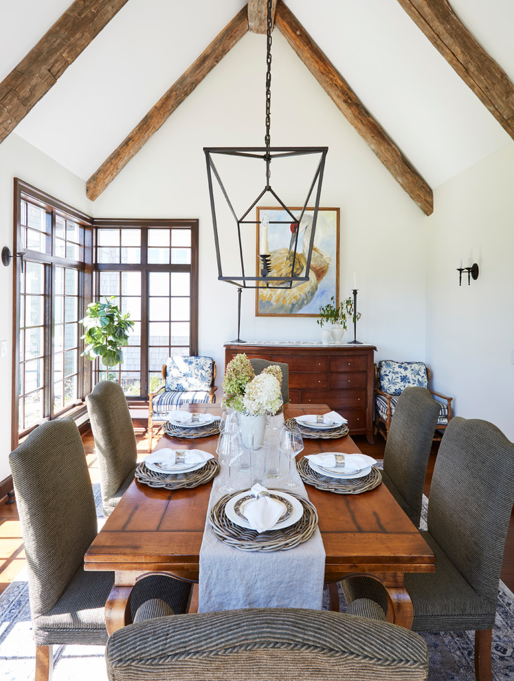 Inspiration for a large farmhouse enclosed dining room in Chicago with white walls, medium hardwood flooring, no fireplace and brown floors.