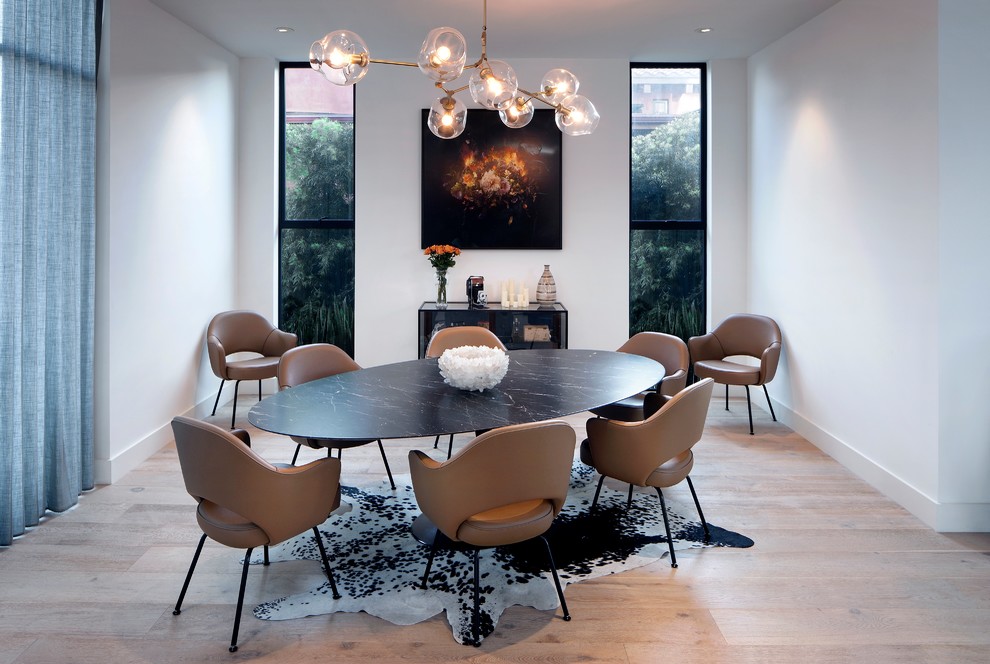 Large contemporary kitchen/dining room in Los Angeles with white walls, light hardwood flooring and beige floors.