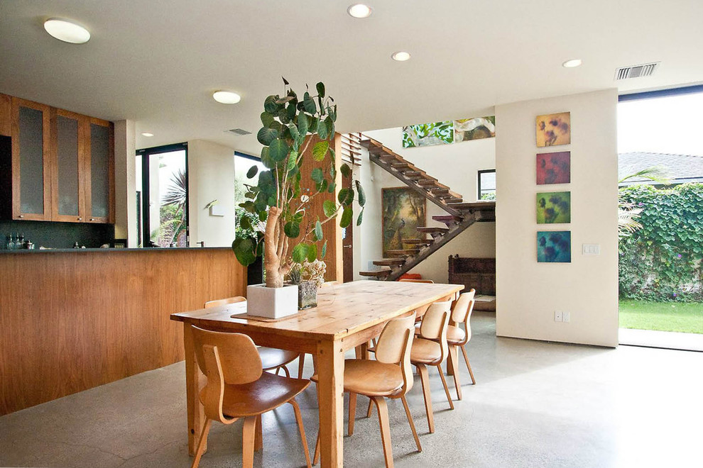 Inspiration for a 1960s concrete floor and gray floor kitchen/dining room combo remodel in New York with white walls and no fireplace