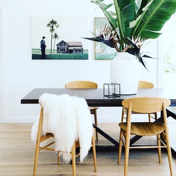 Medium sized scandi dining room in Los Angeles with white walls, light hardwood flooring, no fireplace and brown floors.