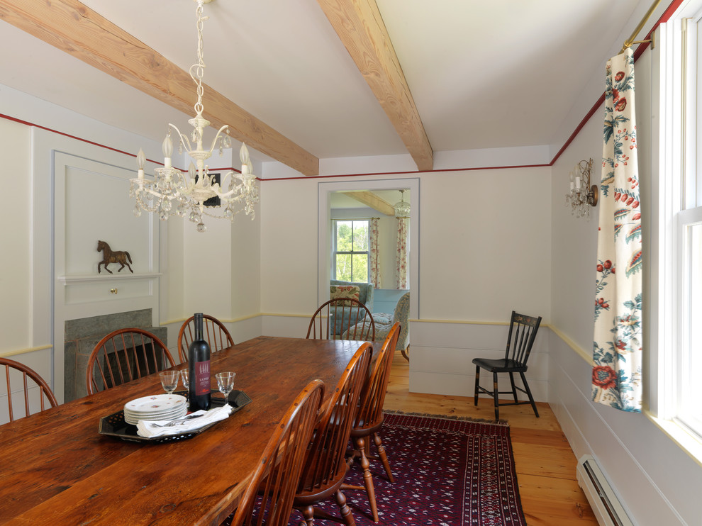 Country dining room in Burlington with white walls.