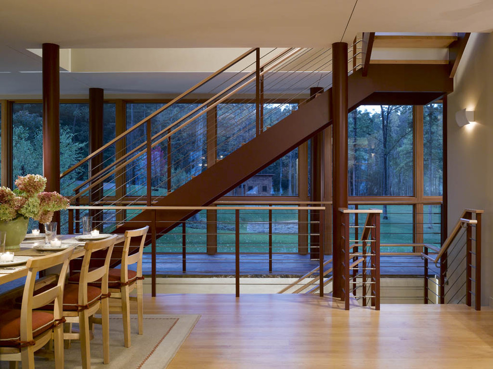 Design ideas for a rustic dining room in Burlington with light hardwood flooring.
