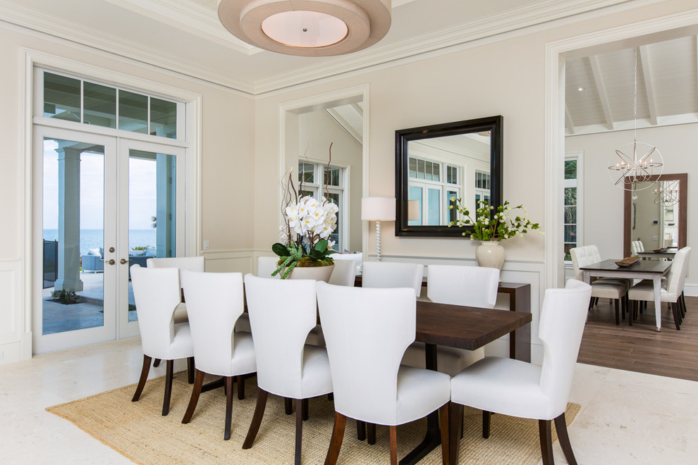 Beach style enclosed dining room in Miami with beige walls.