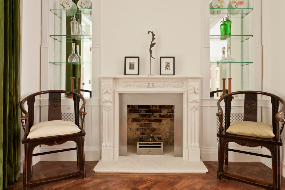 Inspiration for a retro dining room in London with a stone fireplace surround.