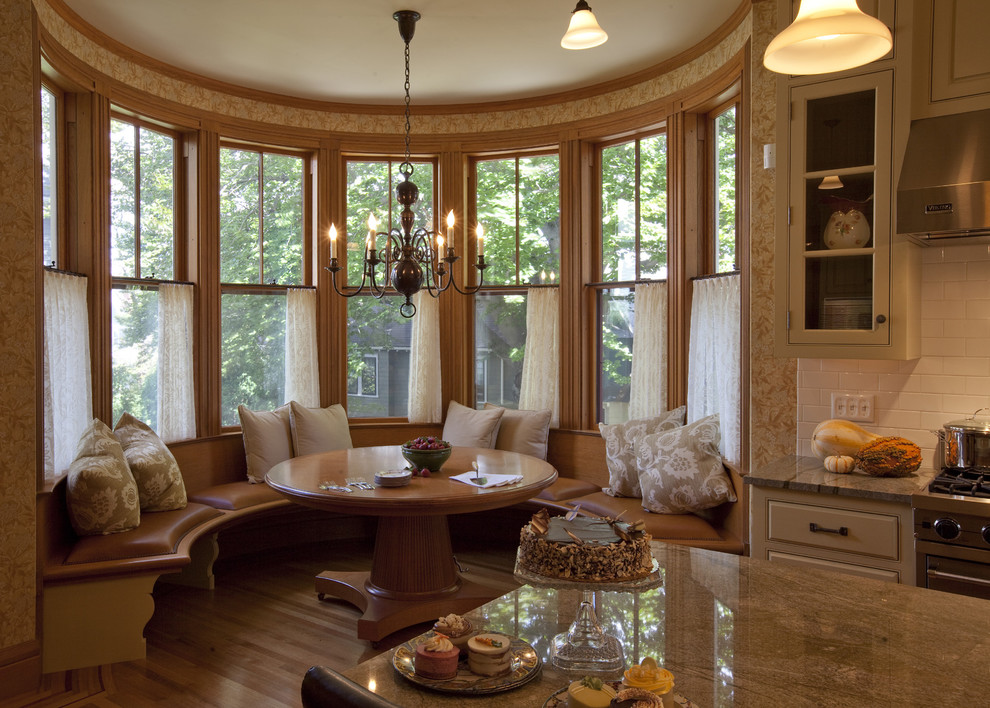 Ornate dark wood floor kitchen/dining room combo photo in Boston