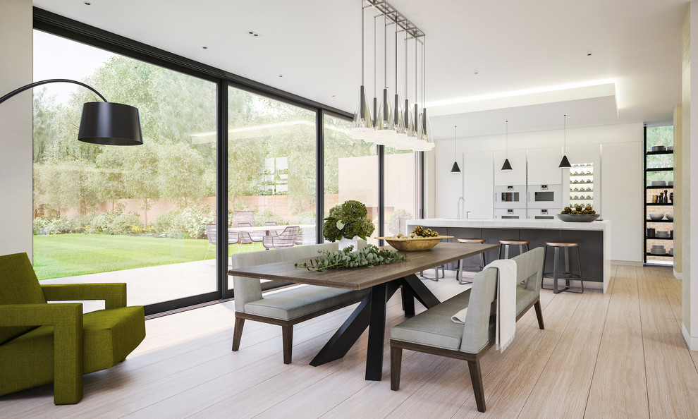 Design ideas for an expansive contemporary open plan dining room in London with white walls, light hardwood flooring, no fireplace and feature lighting.