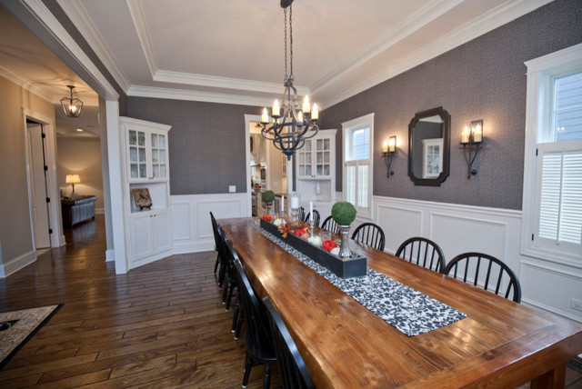 Large farmhouse enclosed dining room in Chicago with grey walls and medium hardwood flooring.
