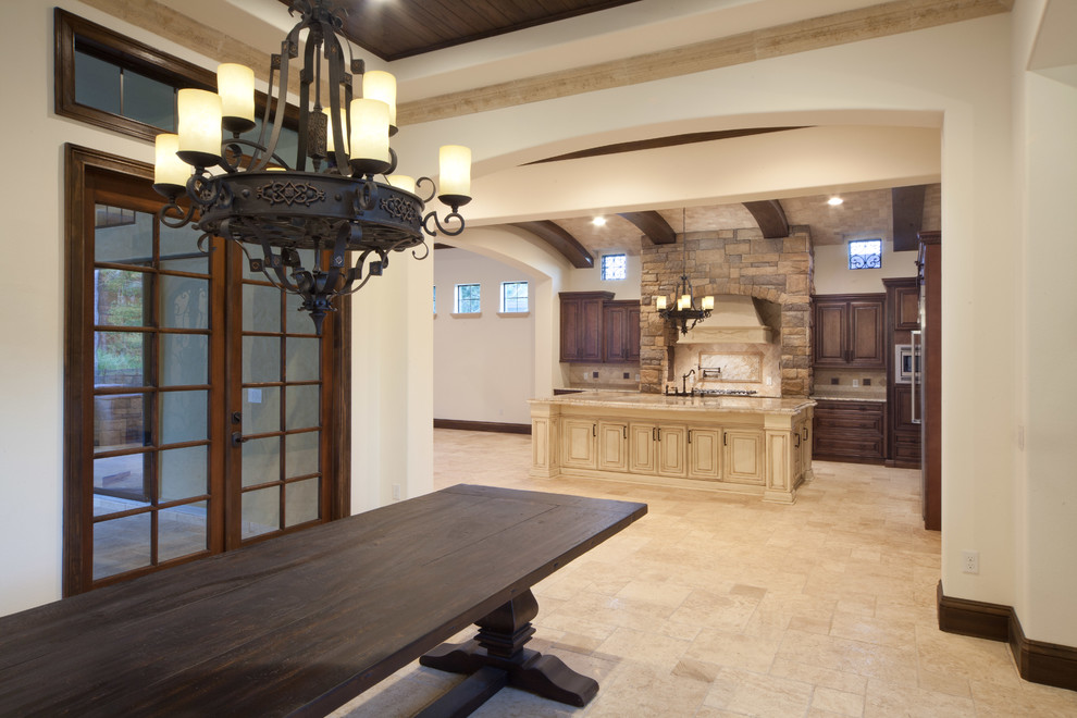 Large tuscan travertine floor great room photo in Orlando with beige walls and no fireplace