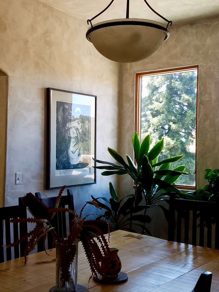 Inspiration for a small mediterranean dining room remodel in Other with beige walls and no fireplace