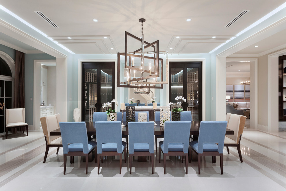 Foto di una grande sala da pranzo design con pareti blu e pavimento in gres porcellanato