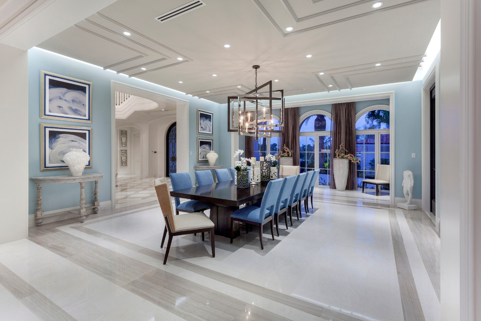 Design ideas for a large contemporary dining room in Miami with blue walls and porcelain flooring.