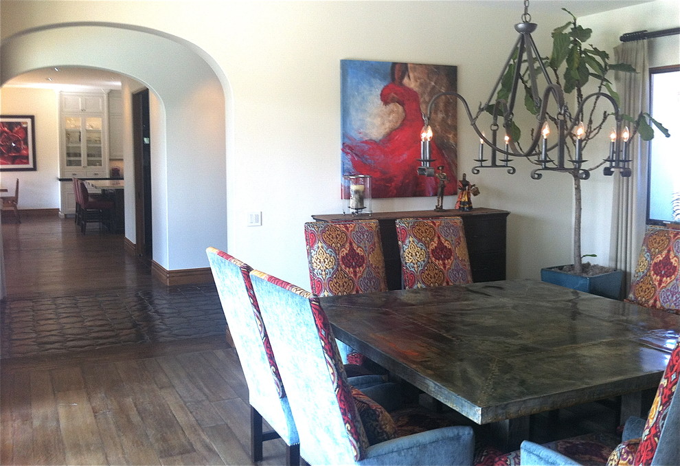 Dining room - large mediterranean medium tone wood floor dining room idea in Orange County with beige walls