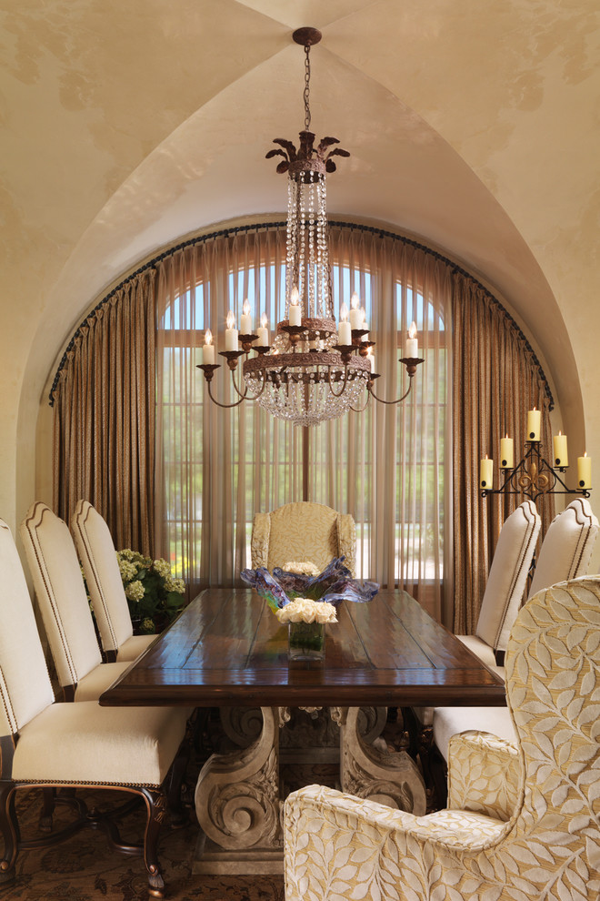 Design ideas for a mediterranean dining room in Tampa with beige walls.