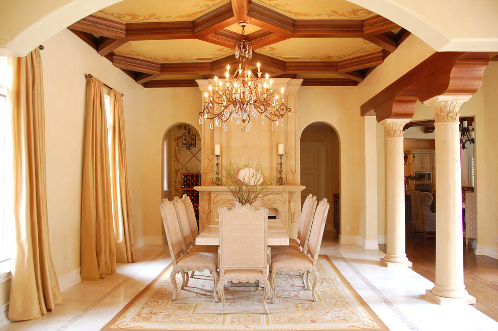Example of a mid-sized tuscan porcelain tile great room design in Orlando with yellow walls, a standard fireplace and a stone fireplace