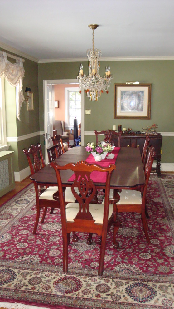 Example of a large classic medium tone wood floor kitchen/dining room combo design in Philadelphia with green walls