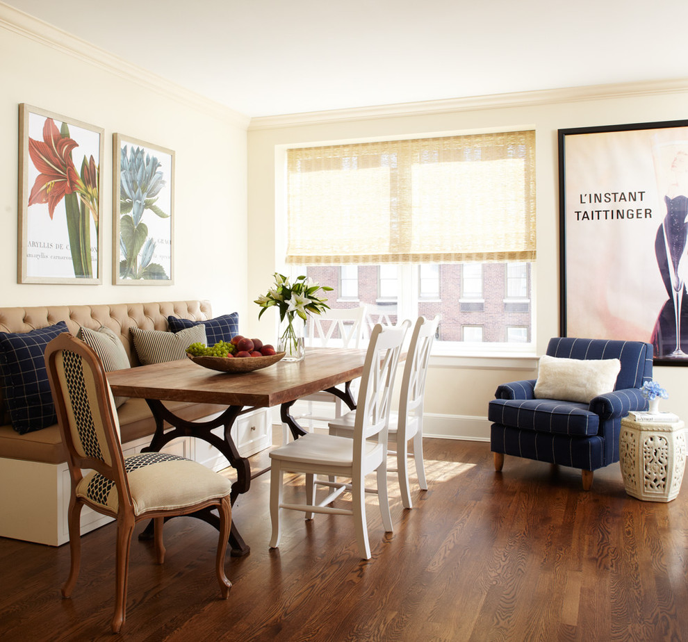 Example of a mid-sized classic medium tone wood floor and brown floor kitchen/dining room combo design in Chicago with yellow walls and no fireplace