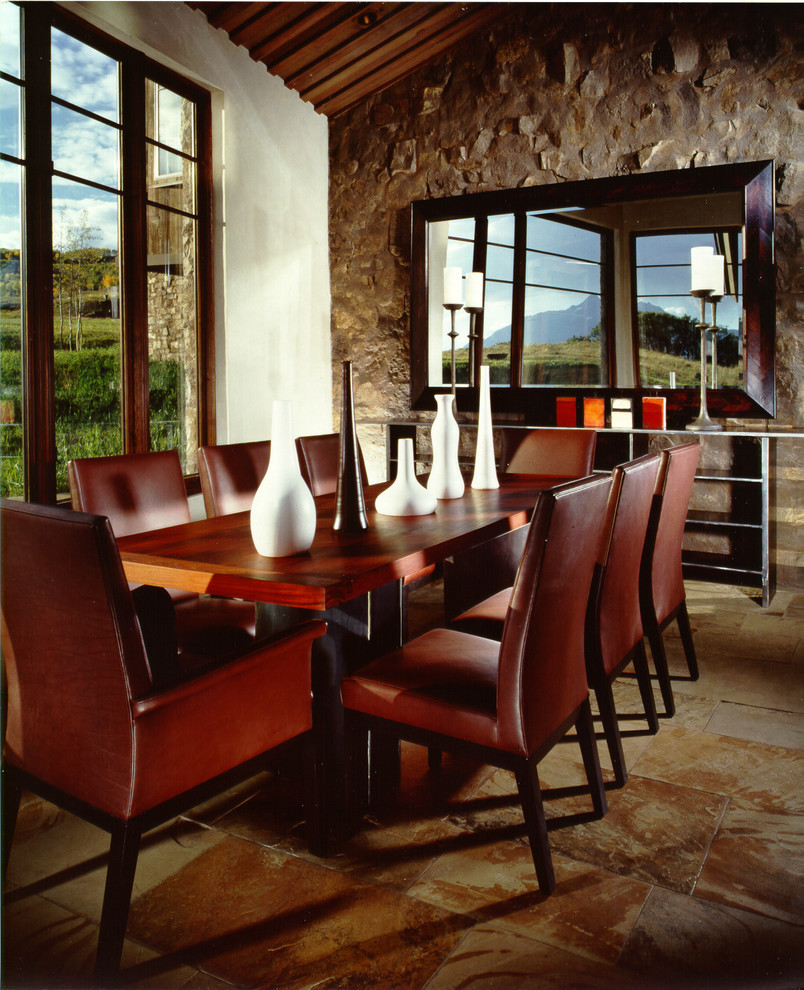 Dining room - rustic dining room idea in Denver