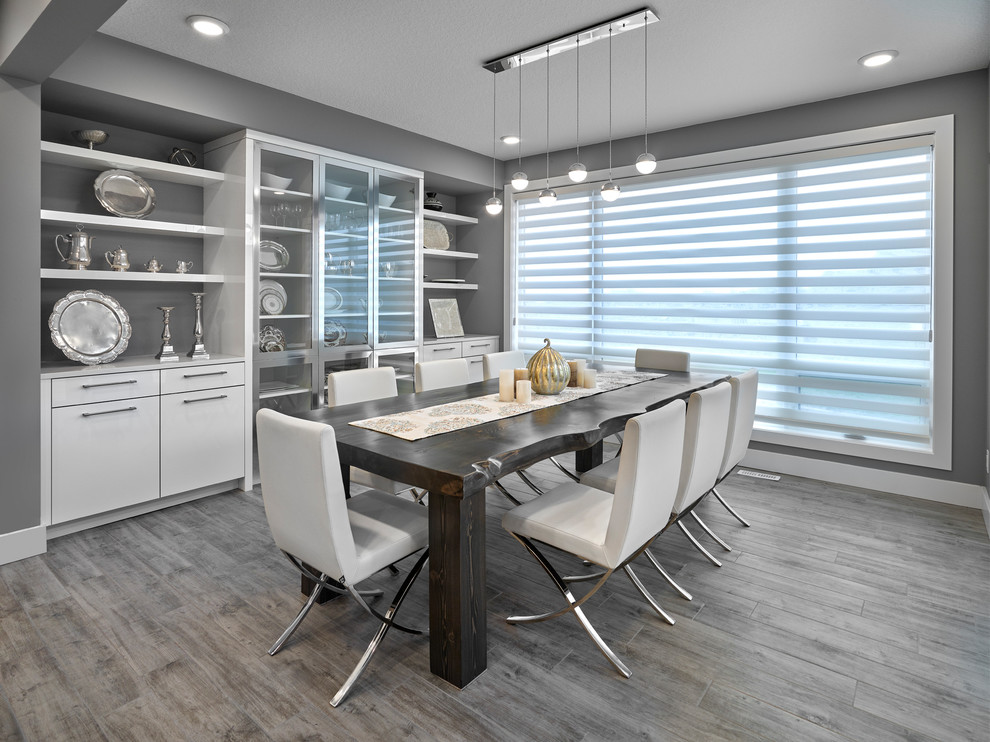 Medium sized contemporary kitchen/dining room in Edmonton with grey walls, porcelain flooring and grey floors.
